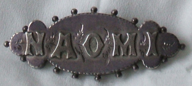 Naomi's name pin